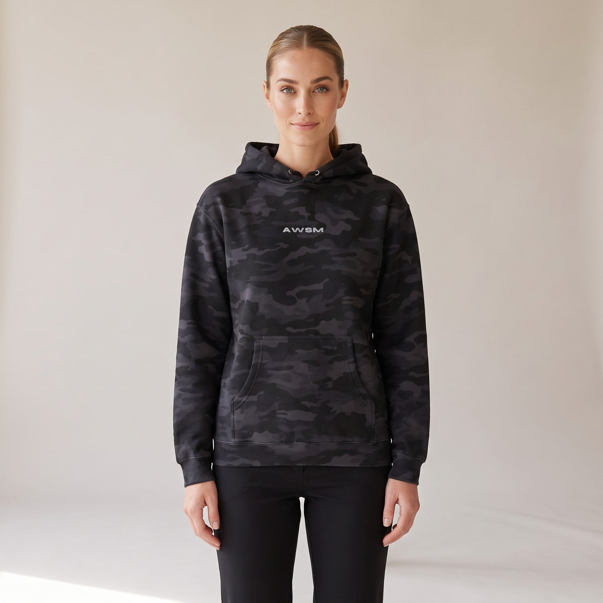 Vanguard Heavyweight Hoodie — AWSM Field in Night Camo, shown on the AWSM house model
